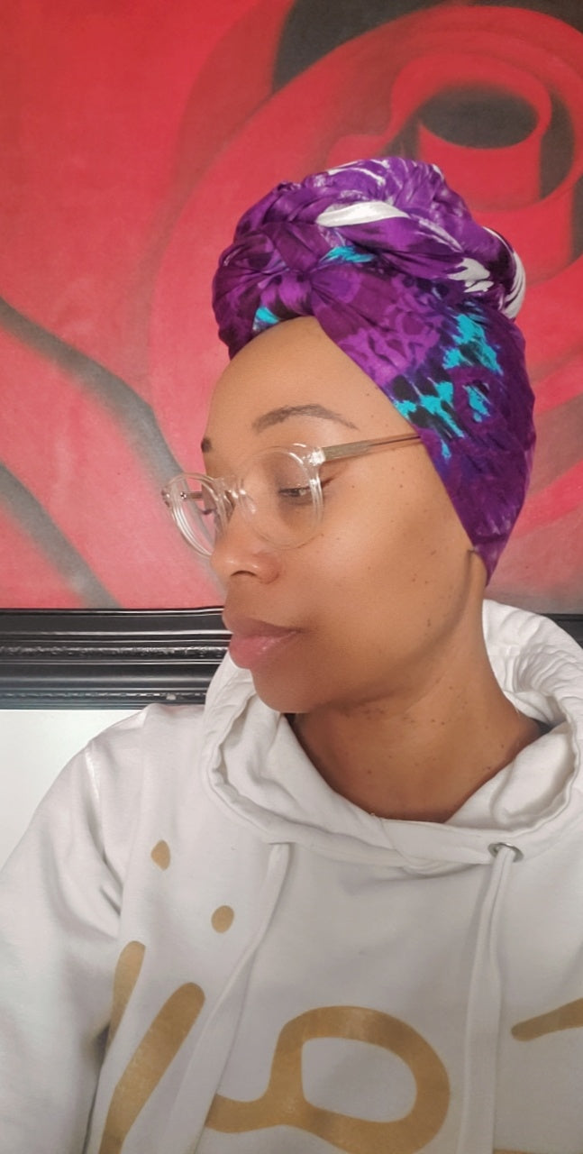 woman wearing stretch extra long purple reign headwrap