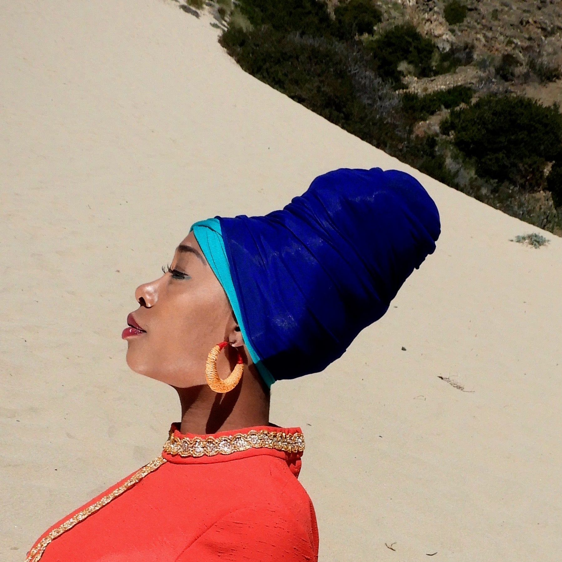women in stretchy royal blue and teal headwraps
