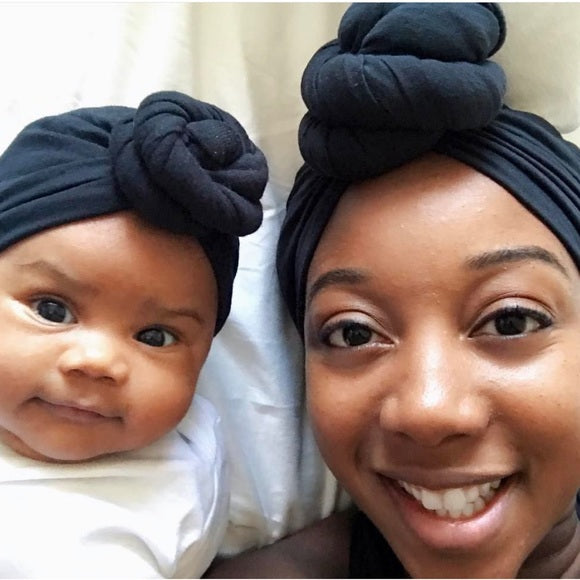 mom & daughter wearing black stretch head wraps. mommy & me
